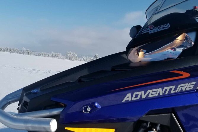 1.5-Hour Guided Snowmobiling Adventure - Getting dressed for a Quebec winter ride