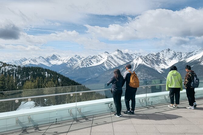 Banff Winter Tour Featuring Mountaintop Dinner and Banff Gondola - Surprise Corner and Bow Falls: Banff landmarks before nightfall
