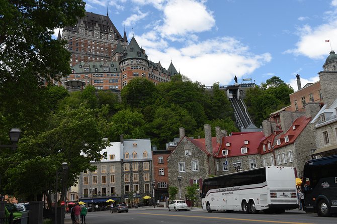 Best of Quebec City: Panoramic Bus Tour with Local Guide - Place d’Armes, the city walls, and Château Frontenac