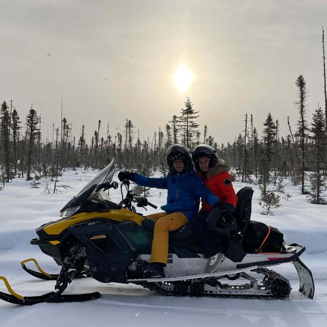 Laurentians: Snowmobile Guided Tour - Getting suited up for Quebec cold