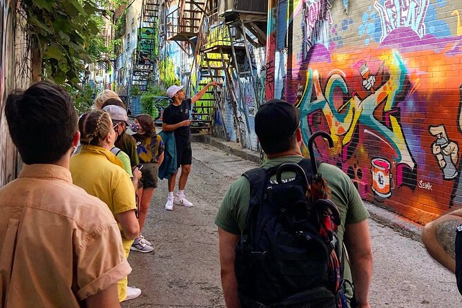 The Original Montreal Mural Arts Tour by Spade & Palacio - The Leonard Cohen mural and Montreal’s larger walls